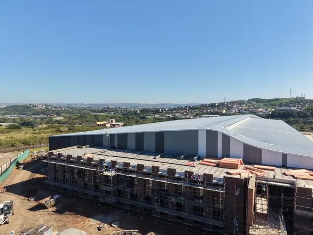 Linked warehouse halls at Brickworx with fresh grey steel roofing