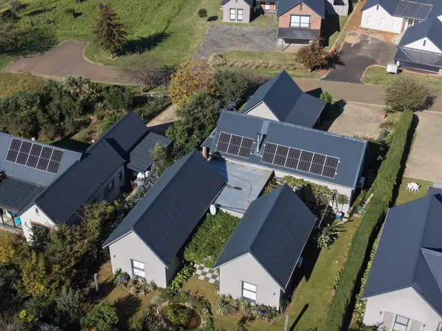 Street of new houses at St Johns with matching steel roofing